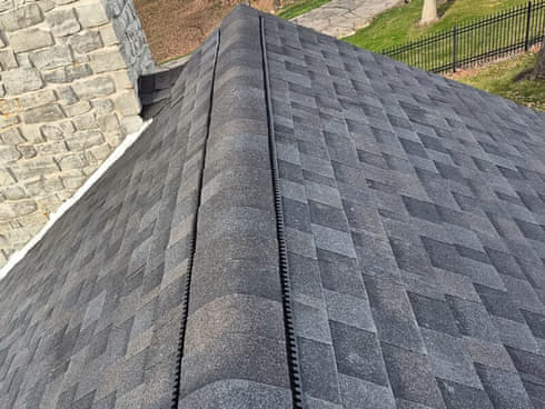 Black asphalt shingle roof installed by Elite