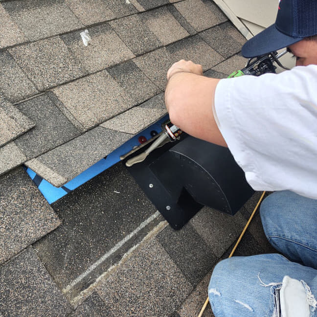 Elite roofer sealing a roof vent during a roof repair in Loves Park IL