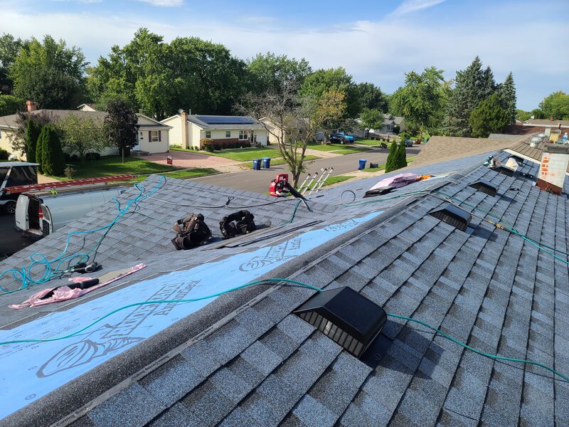 Belvidere roofing contractor installing asphalt shingles on an East Side Belvidere IL ranch home